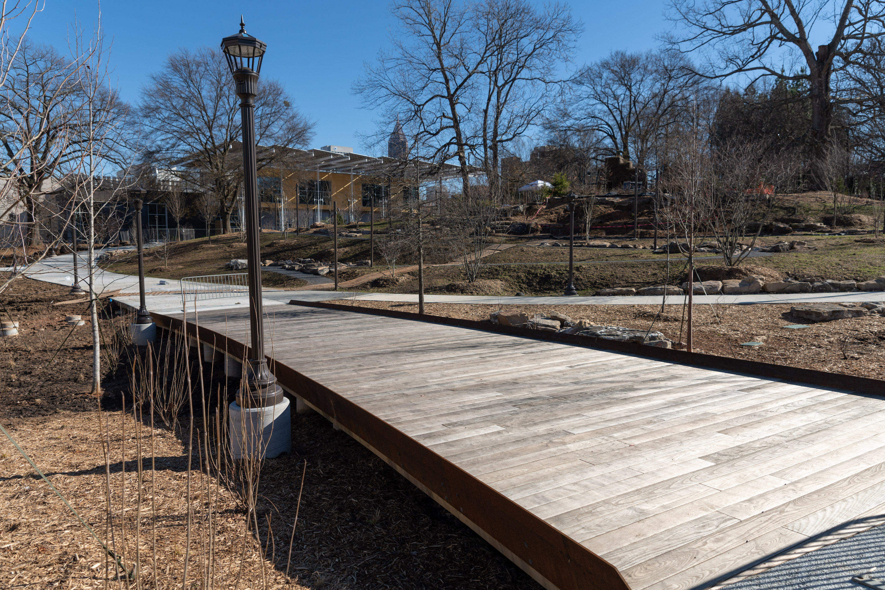 Bridge decking is made from thermal treated white ash with sides constructed of weathered steel. Bridge decking is made from thermal treated white ash with sides constructed of weathered steel.